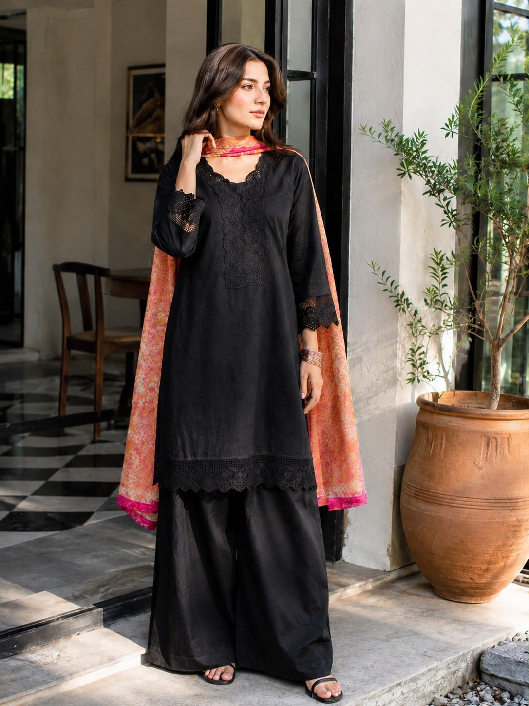 Black kurta and trouser set styling detail